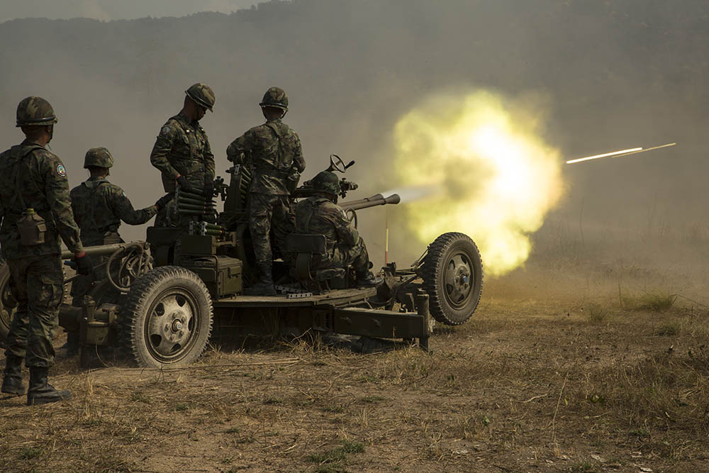 Royal Thai Marines fire a 37mm anti-aircraft gun during a combined arms live-fire exercise Thursday. Photo: Lance Cpl. Kenny Nunez / U.S. Marine Corps