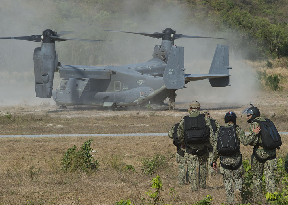 Sailors assigned to an Explosive Ordnance Disposal Mobile Unit and the Royal Thai Navy participate in joint military free-fall training Thursday in Sattahip.