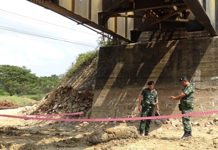 Soldiers at the scene of the bomb discovery Tuesday.