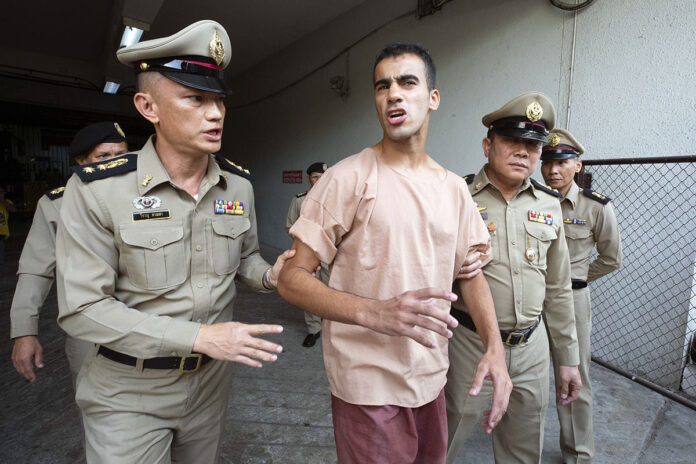 Bahraini Hakeem al-Araibi, center, leaves the criminal court in Bangkok, Thailand, Bangkok, Thailand, Monday, Feb. 4, 2019. The soccer player who has refugee status in Australia told a Thai court Monday that he refuses to be voluntarily extradited to Bahrain, which has asked for his return to serve a prison sentence for a crime he denies committing. Photo: Wason Wanichakorn / AP