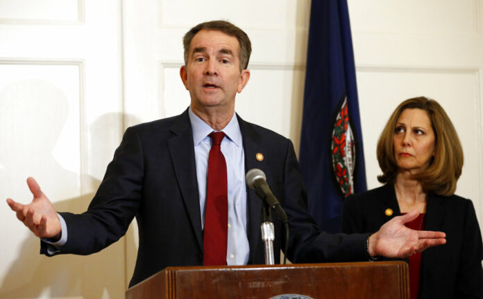 In this Feb. 2, 2019, photo, Virginia Gov. Ralph Northam, left, accompanied by his wife, Pam, speaks during a news conference in the governor's mansion in Richmond, Virginia. Photo: Steve Helber / Associated Press