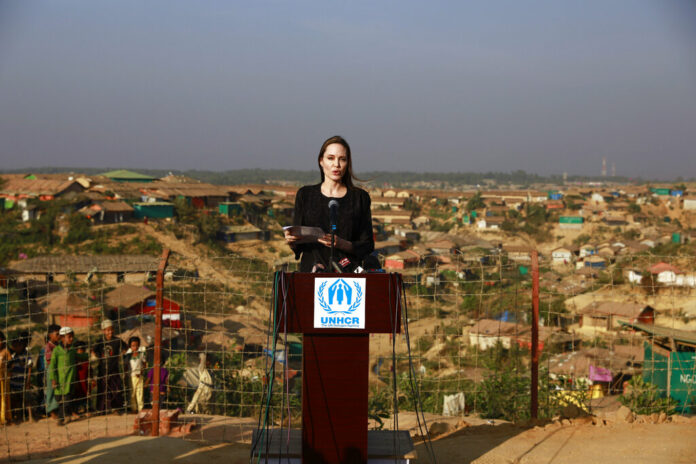 Hollywood actress Angelina Jolie addresses a press conference Tuesday at Kutupalong refugee camp in Cox's Bazar, Bangladesh. Photo: Associated Press Hollywood actress Angelina Jolie addresses a press conference Tuesday at Kutupalong refugee camp in Cox's Bazar, Bangladesh. Photo: Associated Press