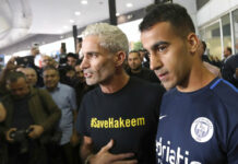 Hakeem Release a Favor From Bahrain: Foreign Minister Refugee soccer player Hakeem Al-Araibi, right, arrives Tuesday in Melbourne, Australia. David Crosling / Associated Press