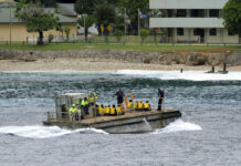 Australia to Reopen Island Detention Camp After Refugee Bill A group of Vietnamese asylum seekers are taken by barge to a jetty in 2013 on Australia's Christmas Island. Photo: Associated Press