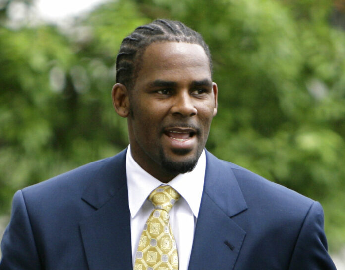 This June 13, 2008 file photo shows R&B singer R. Kelly, arriving at 3the Cook County Criminal Court Building in Chicago. Photo: M. Spencer Green / Associated Press