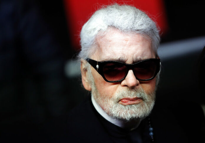 FILE - In this Thursday, Nov. 22, 2018 file photo, Fashion designer Karl Lagerfeld poses during the Champs Elysee Avenue illumination ceremony for the Christmas season, in Paris. Photo: Christophe Ena / Associated Press