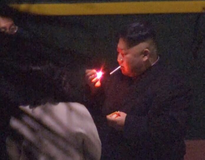 North Korean leader Kim Jong Un, a habitual smoker, takes a pre-dawn smoke break Tuesday at the train station in Nanning, China, hours before his arrival in Vietnam for his high-stakes summit with President Donald Trump over resolving the international standoff over the North’s nuclear weapons and missiles. Image: Associated Press