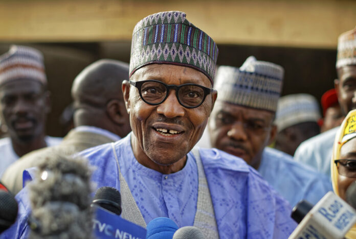 Nigeria's President Muhammadu Buhari speaks Saturday to the media after casting his vote in his hometown of Daura, in northern Nigeria. Photo: Ben Curtis / Associated Press