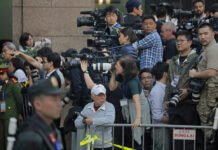 Hanoi Postcard: Vietnam Tames Media Invasion but Sees Upside Journalists gather outside Metropole hotel Wednesday where U.S President Donald Trump and North Korean leader Kim Jong Un are to have their meeting in Hanoi, Vietnam. Photo: Vincent Yu / Associated Press