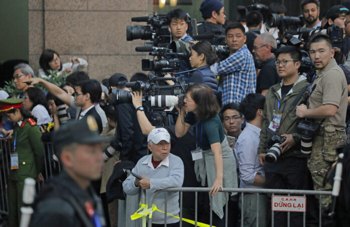 Journalists gather outside Metropole hotel Wednesday where U.S President Donald Trump and North Korean leader Kim Jong Un are to have their meeting in Hanoi, Vietnam. Photo: Vincent Yu / Associated Press