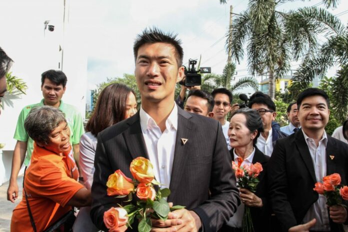 Future Forward Party leader Thanathorn Juangroongruangkit, center, arrives at the Office of the Attorney General Wednesday in Bangkok.