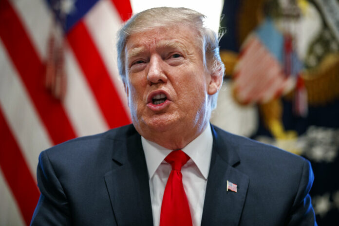 US President Donald Trump speaks in the Cabinet Room of the White House on Friday in Washington. Photo: Evan Vucci / Associated Press US President Donald Trump speaks in the Cabinet Room of the White House on Friday in Washington. Photo: Evan Vucci / Associated Press