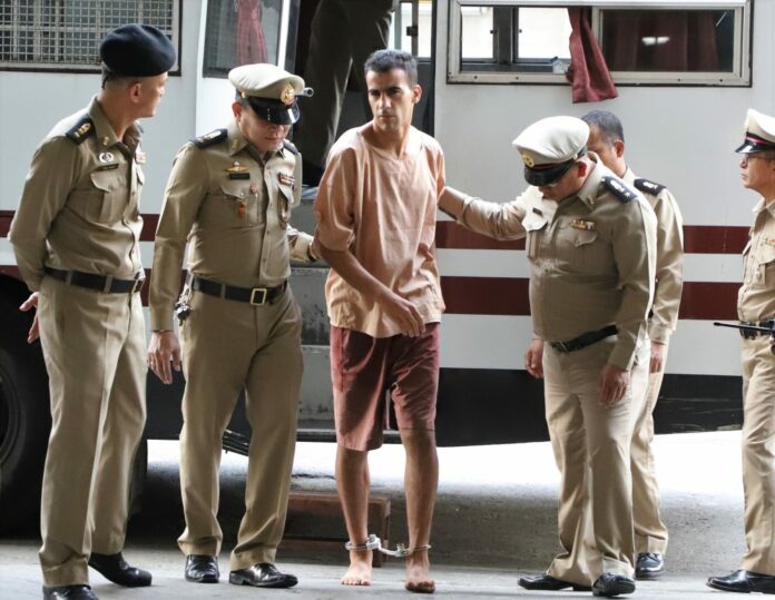 Hakeem AlAraibi is led by police Monday at the Criminal Court in Bangkok.