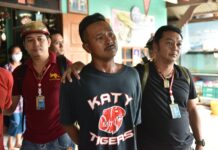 24 Men Charged Over Assault on Bangkok Temple School Wallop Nutfaeng, the lead suspect in the attack on a Bangkok temple school, cries Tuesday as police raid his home.