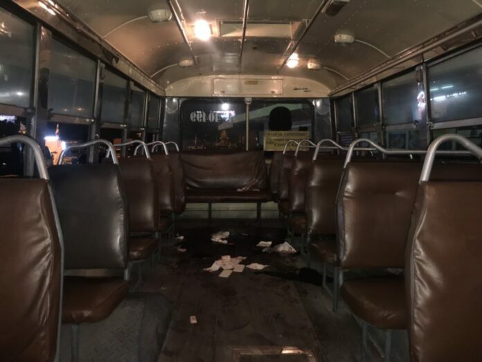 The scene inside a bus Sunday where a Bangkok student was stabbed multiple times after a brawl.
