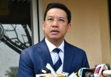 Govt Spokesman Resigns to Join Pro-Junta Party Puttipong Punnakan speaks Tuesday at the Government House in Bangkok.