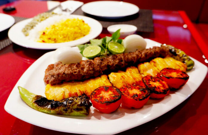 Mixed kebab (600 baht), with loubia polo (220 baht) in background.