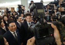 Opinion: Friday’s Political Drama Reignited Political Divisions Thai Raksa Chart Party leader Preechapol Pongpanich talks to reporters Friday morning outside the Election Commission in Bangkok.