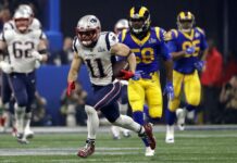 Patriots Beat Rams 13-3 in Lowest Scoring Super Bowl Ever New England Patriots' Julian Edelman (11) runs the ball ahead of Los Angeles Rams' Cory Littleton (58) during the second half of the NFL Super Bowl 53 football game on Sunday in Atlanta. Photo: Jeff Roberson / Associated Press