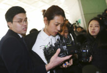 S. Korean Police Question K-pop Stars in Sex Scandals K-pop singer Jung Joon-young, center, arrives Thursday at the Seoul Metropolitan Police Agency in Seoul, South Korea. Photo: Ahn Young-joon / Associated Press