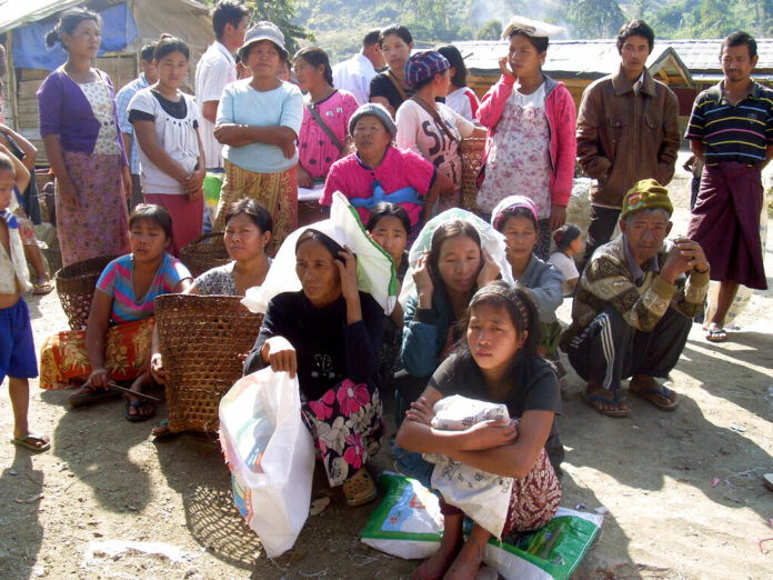 Kachin refugees wait for rations in 2013 at the Je Yang IDP camp, the biggest and closest camp to Laiza, Laiza, northeastern Myanmar. Photo: Yadana Htun / Associated Press Kachin refugees wait for rations in 2013 at the Je Yang IDP camp, the biggest and closest camp to Laiza, Laiza, northeastern Myanmar. Photo: Yadana Htun / Associated Press