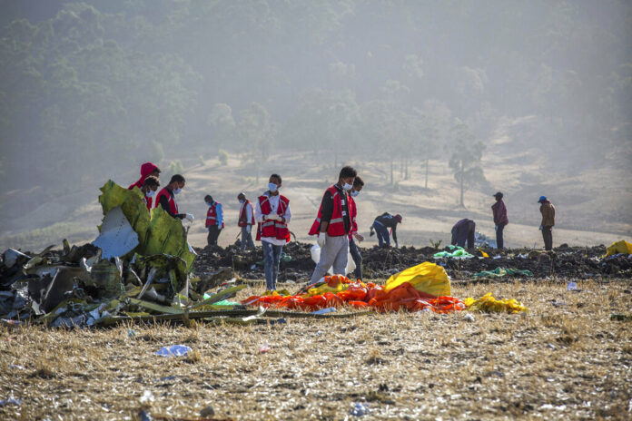 In this March 11, 2019, file photo rescuers work at the scene of an Ethiopian Airlines flight crash near Bishoftu, or Debre Zeit, south of Addis Ababa, Ethiopia. Photo: Mulugeta Ayene / Associated Press