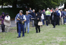 New Zealand Police Have 4 in Custody, Defuse Bombs Police escort witnesses away from a mosque Friday in central Christchurch, New Zealand Photo: Mark Baker / Associated Press