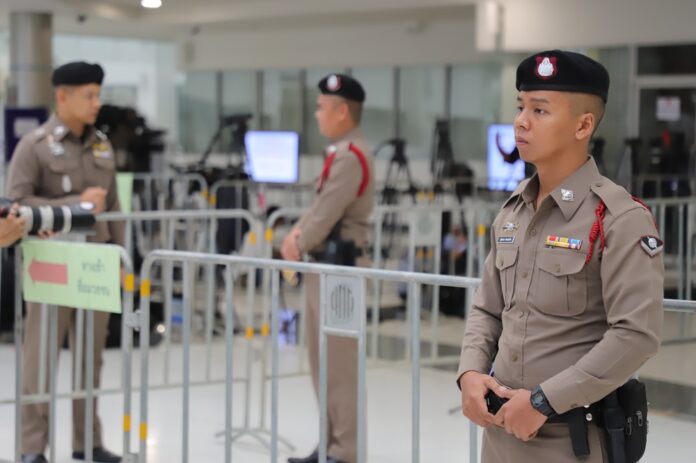 Police stand guard at the Constitutional Court on Thursday.