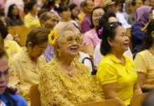 Parties Woo Thai Elderly With Expanded Safety Net An audience listens to speeches marking the UN's International Day of Older Persons Oct. 2018 in Bangkok.