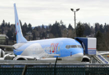 Jet That Crashed in Ethiopia Grounded Across World A Boeing 737 MAX 8 airplane being built for TUI Group sits at Boeing Co.'s Renton Assembly Plant on March 11 in Renton, Washington. Photo: Ted S. Warren / Associated Press