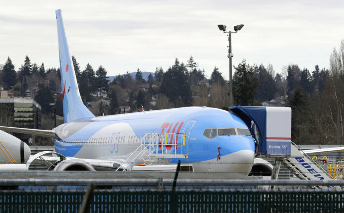 A Boeing 737 MAX 8 airplane being built for TUI Group sits at Boeing Co.'s Renton Assembly Plant on March 11 in Renton, Washington. Photo: Ted S. Warren / Associated Press