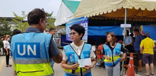 UN employees Sunday at a Bangkok polling station.