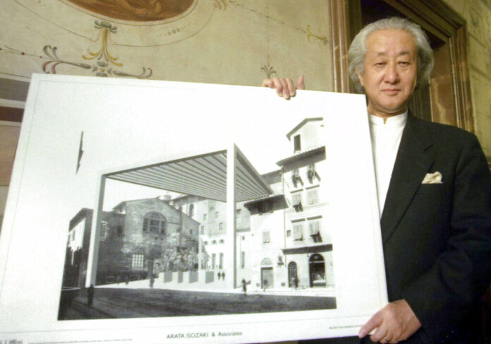 FILE - In this Feb. 21, 2001, file photo, Japanese architect Arata Isozaki holds the illustration of his project for the new exit of Florence's Uffizi museum, in Florence, Italy. Photo: Francesco Bellini / Associated Press