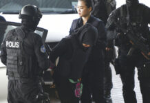 Indonesian Woman Freed 2 Years After Kim Jong Nam’s VX Death Indonesian Siti Aisyah, center, is escorted by police Monday as she arrives at Shah Alam High Court in Shah Alam, Malaysia. Photo: Yam G-Jun / Associated Press