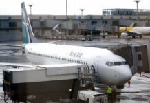 Boeing 737 Max Banned From Singaporean Airspace SilkAir's new Boeing 737 Max 8 aircraft is seen through a viewing gallery window in 2017 parked on the ramp of Singapore's Changi International Airport. Photo: Wong Maye-E / Associated Press
