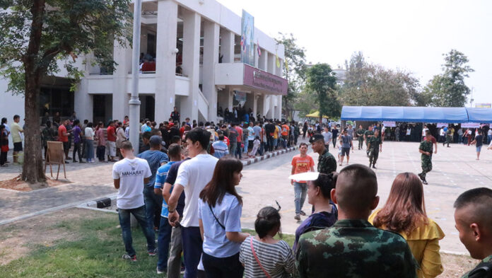 Long queues of voters outside a polling station Sunday in Nakhon Ratchasima province.