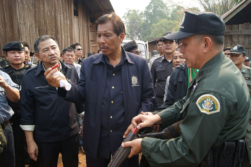 Damrong Phidej examines a bullet as parks director in 2012.