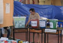 Poll Results Leave Nation Puzzled with Many Math Mysteries An official prepares to count ballots Sunday at a polling station in Bangkok’s Phra Khanong district.