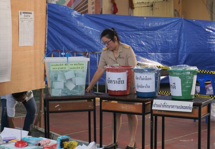 An official prepares to count ballots Sunday at a polling station in Bangkok’s Phra Khanong district.
