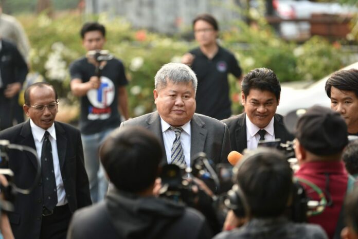 Premchai Karnasuta arrives Tuesday at the Thong Pha Phum Provincial Court in Kanchanaburi province.