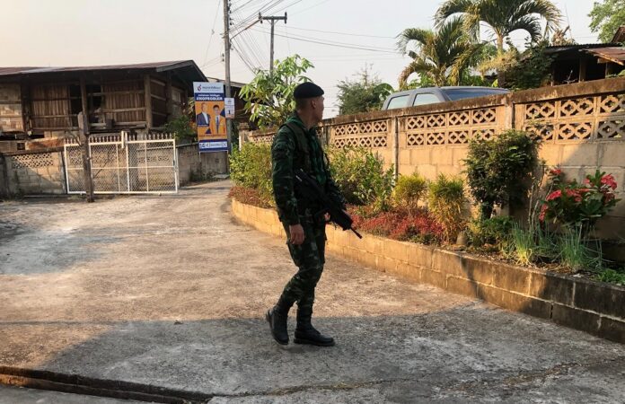 Soldiers search the home of a Democrat politician Wednesday in Mae Hong Son province.