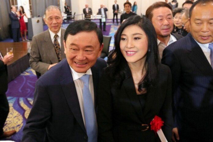 A file photo of former leaders Thaksin and Yingluck Shinawatra.