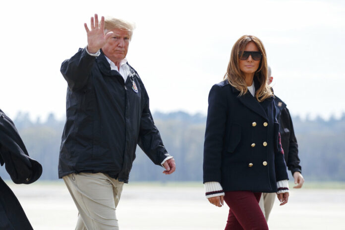 US President Donald Trump and first lady Melania Trump walk from Marine One to board Air Force One on March 8 at Lawson Army Airfield, Fort Benning, Georgia. Photo: Carolyn Kaster / Associated Press