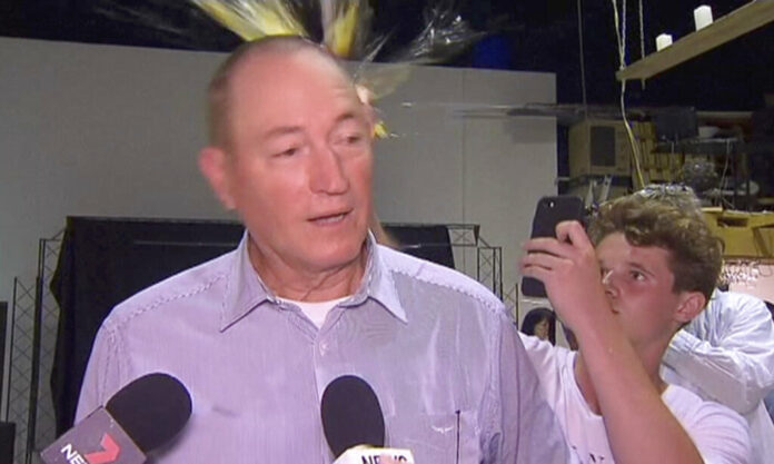 A teenager breaks an egg on the head of Australian Sen. Fraser Anning while he holds a press conference Saturday in Melbourne. Photo: Associated Press A teenager breaks an egg on the head of Australian Sen. Fraser Anning while he holds a press conference Saturday in Melbourne. Photo: Associated Press