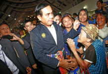 Prayuth Croons, Brags on ‘Official’ Trip to Korat Prime Minister Gen. Prayuth Chan-ocha and candidate for the same position, greets supporters as he attends a government-sponsored event Wednesday in Korat. Photo: Sakchai Lalit / Associated Press