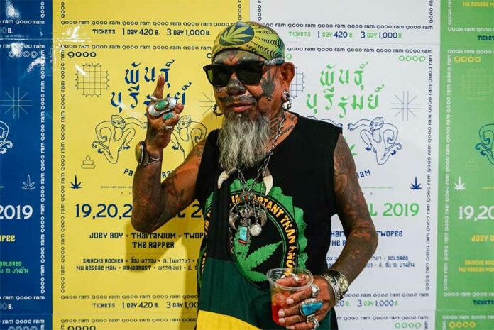 A supporter shows his love at a Friday news conference for a cannabis festival next month in Buriram province.