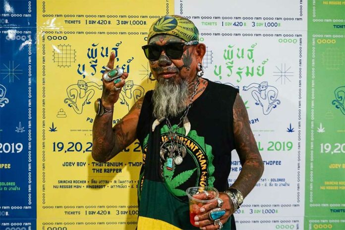 A supporter shows his love at a Friday news conference for a cannabis festival next month in Buriram province. A supporter shows his love at a Friday news conference for a cannabis festival next month in Buriram province.