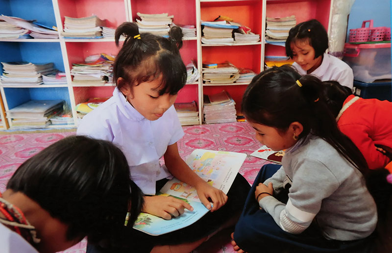 Students in Tak province read in their school library on May 10, 2018.