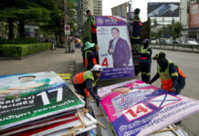 Analysis: Thai Election Shows Divisions and Instability Remain In this March 27, 2019, file photo, workers load campaign billboards displayed to promote candidates for a general election into a truck in Bangkok, Thailand. Photo: Gemunu Amarasinghe / Associated Press