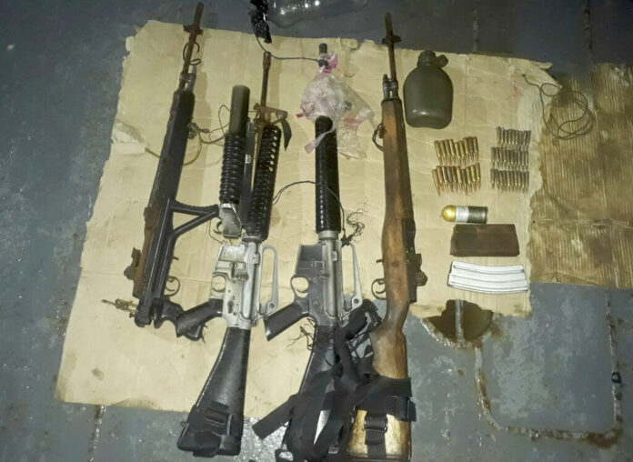 This photo provided by WESMINCOM Armed Forces of the Philippines Sunday, April 7, 2019, shows recovered firearms from Muslim extremist Abu Sayyaf kidnappers following a rescue operation that freed Indonesian hostage Heri Ardiansyah and two others off Simisa island, Sulu province in southern Philippines. Photo: WESMINCOM Armed Forces of the Philippines via AP